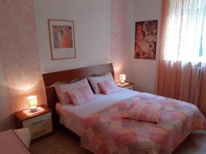 Posteľ alebo postele v izbe v ubytovaní Saglia Apartments