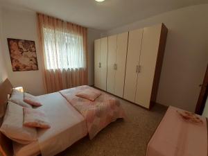 Posteľ alebo postele v izbe v ubytovaní Saglia Apartments