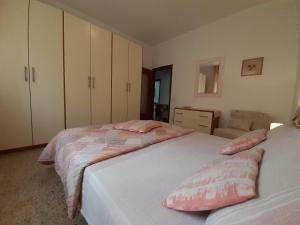 Posteľ alebo postele v izbe v ubytovaní Saglia Apartments