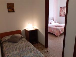 Posteľ alebo postele v izbe v ubytovaní Saglia Apartments