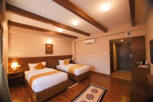 Letto o letti in una camera di Hotel Bhadgaon