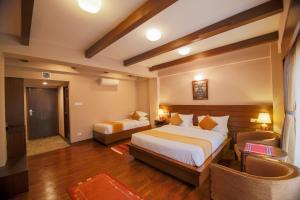Letto o letti in una camera di Hotel Bhadgaon