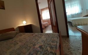 Posteľ alebo postele v izbe v ubytovaní Saglia Apartments