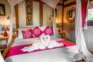 Ein Bett oder Betten in einem Zimmer der Unterkunft Swasti Eco Cottages
