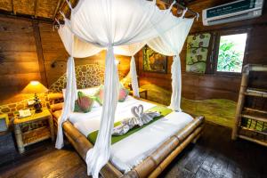 Ein Bett oder Betten in einem Zimmer der Unterkunft Swasti Eco Cottages
