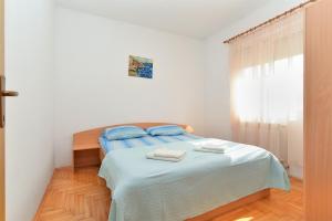 Postel nebo postele na pokoji v ubytování Apartments Edin 1359
