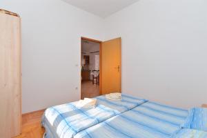 Postel nebo postele na pokoji v ubytování Apartments Edin 1359