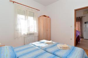 Postel nebo postele na pokoji v ubytování Apartments Edin 1359