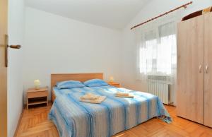 Postel nebo postele na pokoji v ubytování Apartments Edin 1359
