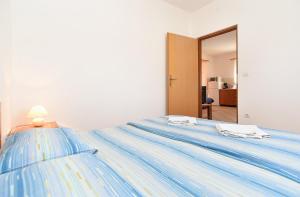 Postel nebo postele na pokoji v ubytování Apartments Edin 1359