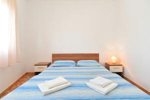 Postel nebo postele na pokoji v ubytování Apartments Edin 1359