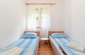 Postel nebo postele na pokoji v ubytování Apartments Edin 1359