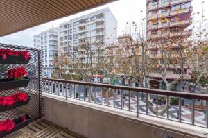a balcony with a view of a city with tall buildings at AG GERMANIAS CIUDAD in Gandía