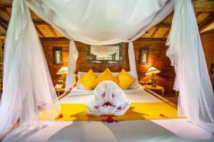 Ein Bett oder Betten in einem Zimmer der Unterkunft Swasti Eco Cottages