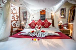 Ein Bett oder Betten in einem Zimmer der Unterkunft Swasti Eco Cottages