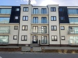 a large apartment building with windows on a street at Cap Horn 0205 in Koksijde