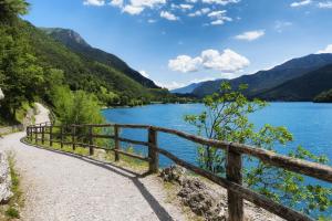 a path next to a lake at Casa Valentina in Ledro