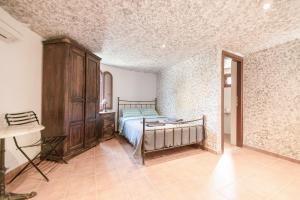 Postel nebo postele na pokoji v ubytování Tsolis Village + 18 fotografií