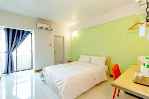 Cama ou camas em um quarto em Living Naraa Place