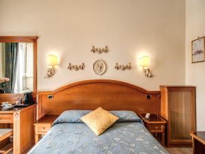 Voodi või voodid majutusasutuse Hotel Labelle toas
