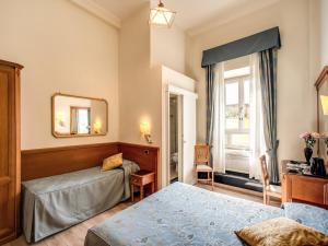Voodi või voodid majutusasutuse Hotel Labelle toas