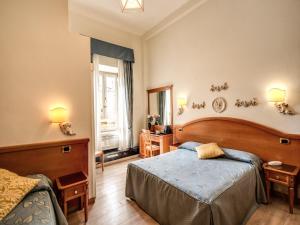 Voodi või voodid majutusasutuse Hotel Labelle toas
