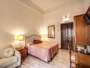 Voodi või voodid majutusasutuse Hotel Labelle toas