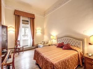 Voodi või voodid majutusasutuse Hotel Labelle toas