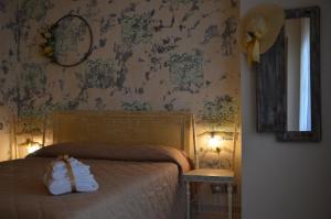 سرير أو أسرّة في غرفة في La Casa di Angy