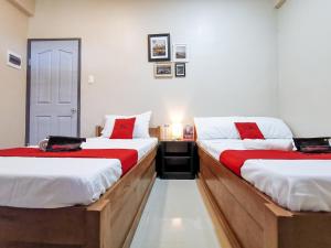Ένα ή περισσότερα κρεβάτια σε δωμάτιο στο RedDoorz near Gaisano Mall Gensan