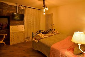 A bed or beds in a room at Il Borgo del Castello