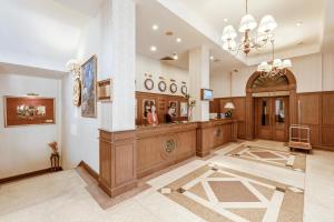 a large lobby with a reception desk and a mirror at Du Parc Hotel Dalat in Da Lat