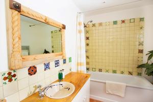 a bathroom with a sink and a tub and a mirror at Vinegar Hill Pottery in Lymington +21 photos