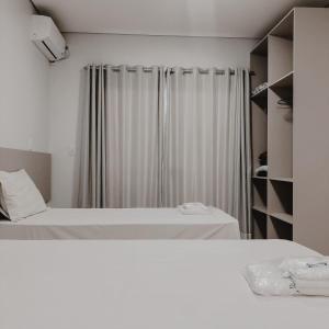 Кровать или кровати в номере Petri Plaza Hotel