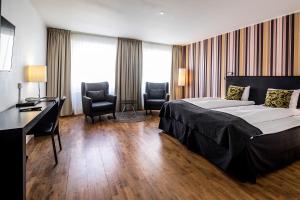 Letto o letti in una camera di First Hotel Witt