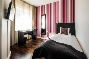 Letto o letti in una camera di First Hotel Witt
