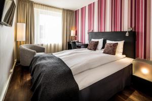 Letto o letti in una camera di First Hotel Witt