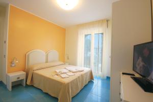 Postel nebo postele na pokoji v ubytování Residence Abruzzo Resort