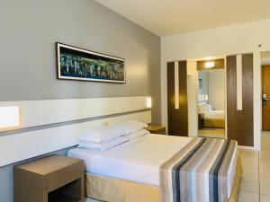 Cama o camas de una habitación en Oasis Atlantico Fortaleza