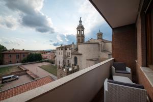 a view from the balcony of a building with a church at San Sisto Residence - Foligno City Center - La Montagnola Affittacamere in Foligno