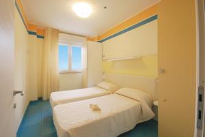 Postel nebo postele na pokoji v ubytování Residence Abruzzo Resort