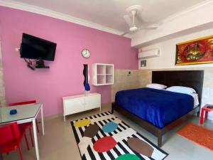Postel nebo postele na pokoji v ubytování Apartahotel Guaraguao