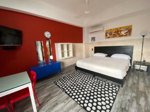Postel nebo postele na pokoji v ubytování Apartahotel Guaraguao