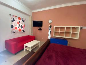 TV a/nebo společenská místnost v ubytování Apartahotel Guaraguao