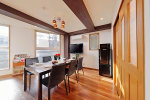 a kitchen and dining room with a table and chairs at Terrace Terano#201 in Tokyo