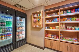 a refrigerator filled with lots of food and drinks at Holiday Inn Express & Suites El Paso Airport, an IHG Hotel in El Paso