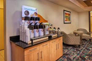 a pharmacyacist with a counter with bottles of wine at Holiday Inn Express & Suites El Paso Airport by IHG in El Paso