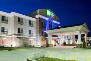 a rendering of a hotel at night at Holiday Inn Express & Suites Jacksonville, an IHG Hotel in South Jacksonville