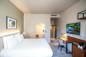 Un pat sau paturi într-o cameră la Mercure Rennes Centre Place Bretagne +84 fotografii