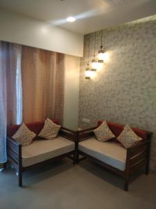 Postel nebo postele na pokoji v ubytování Parishreya Holiday home Lonavala